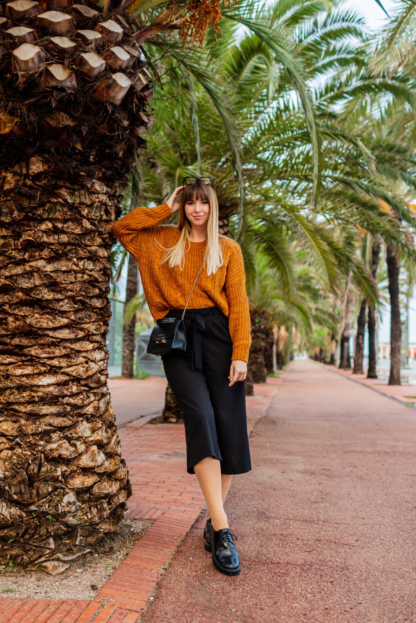 Stylish blond woman enjoing weekend in Spain.  Stylish autumn look.  Travel and vacarion concept. European tourist.  Full lenght.
